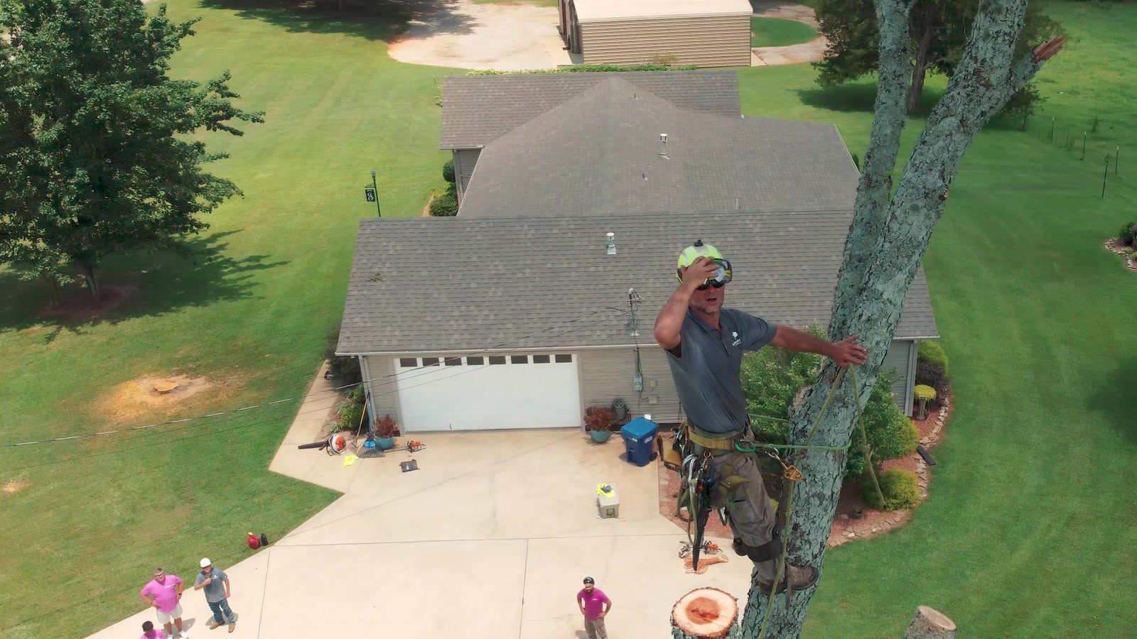 Aerial view of a residential tree removal beside a home in Calhoun County, Alabama
